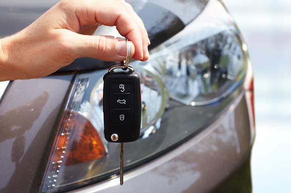 Hand with a car key.